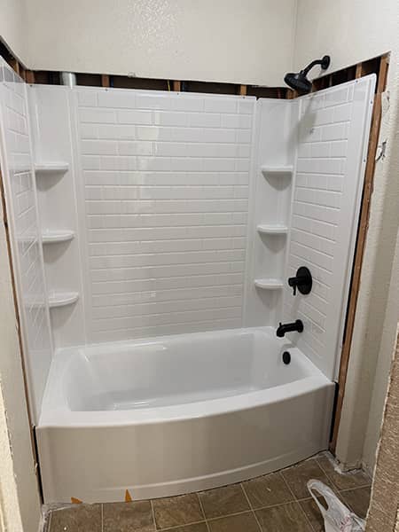 New bathtub and shower enclosure installed by CH Plumbing Services in the High Desert